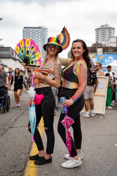 stock image The couple at the Pride Weekend Festival on Church Street. Toronto, Canada - Jun 29, 2024.