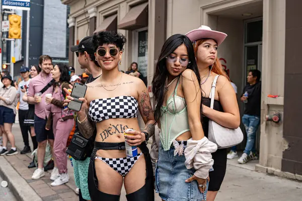 stock image Spectators at the 2024 Annual Pride Parade in Downtown Toronto. Toronto, Canada - Jun 30, 2024.