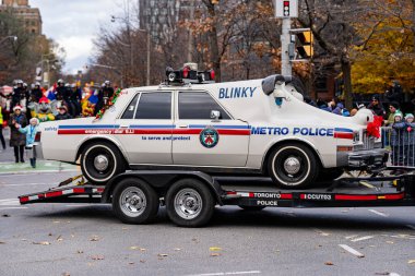 Blinky the Metro Toronto Police car in the Toronto Santa Claus Parade. Toronto, Canada - November 24, 2024. clipart