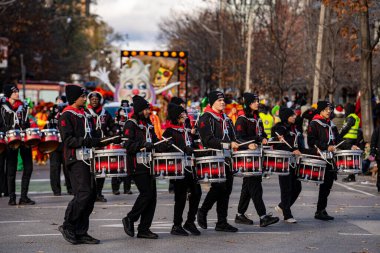 St. Marcellinus Drumline at the Toronto Santa Claus Parade. Toronto, Canada - November 24, 2024. clipart