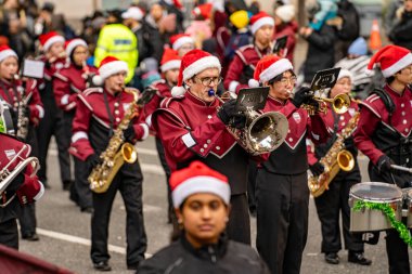 McMaster Marching Band at the Toronto Santa Claus Parade. Toronto, Canada - November 24, 2024. clipart