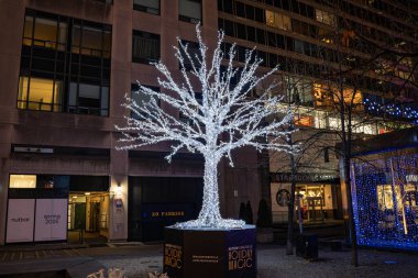 Yorkville Toronto seasonal holiday decorations with lights. Toronto, Canada - December 11, 2024. clipart