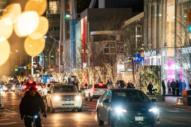 Christmas lights on Bloor Street in Yorkville at evening. Toronto, Canada - December 11, 2024. clipart