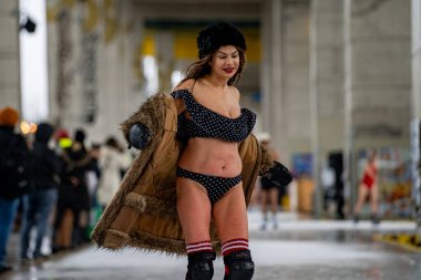 The young women take part in the annual Polar Bear Skate at the Bentway Skate Trail in Toronto. Toronto, Canada - December 29, 2024. clipart