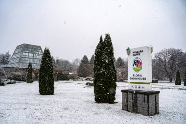 View of the Floral Showhouse in Niagara Falls in snowy weather. Niagara Falls, Canada - December 24, 2024. clipart