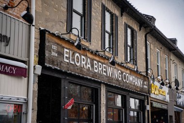 A winter view of Elora Brewing Company in Elora town, Ontario. Elora, Canada - January 2, 2025. clipart