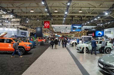 Visitors at the 2025 Canadian International AutoShow. Toronto, Canada - February 14, 2025. clipart