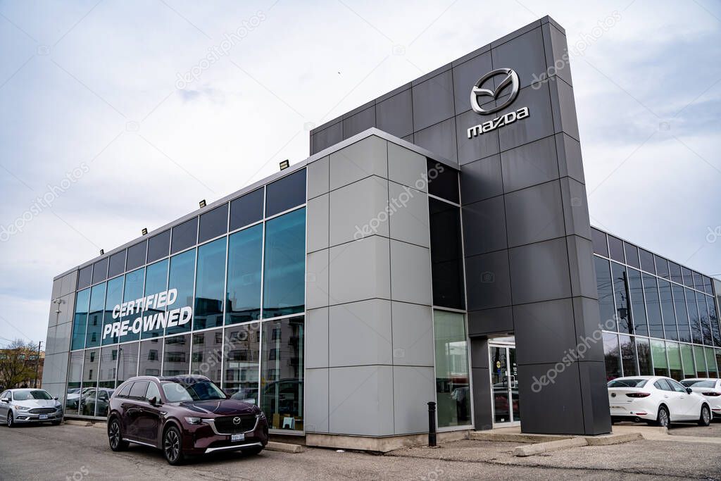 View of Mazda car dealership storefront. Toronto, Canada - April 25, 2025.