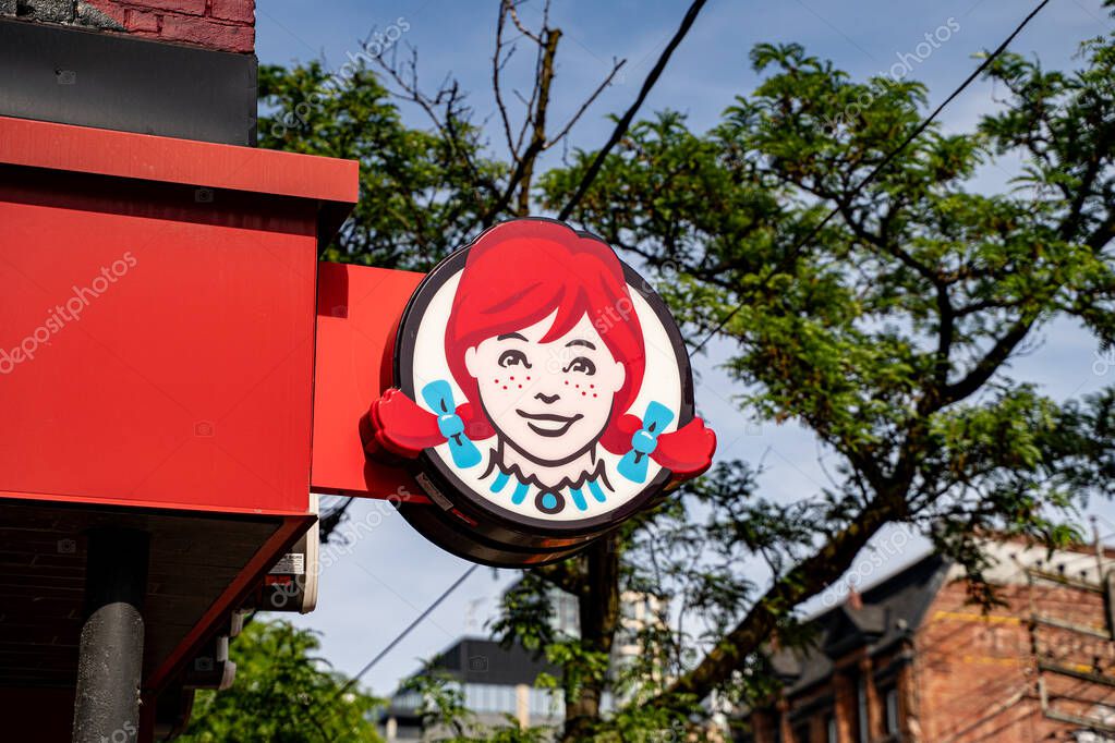 Exterior view of Wendy's restaurant in Toronto. Toronto, Canada - June 15, 2025.