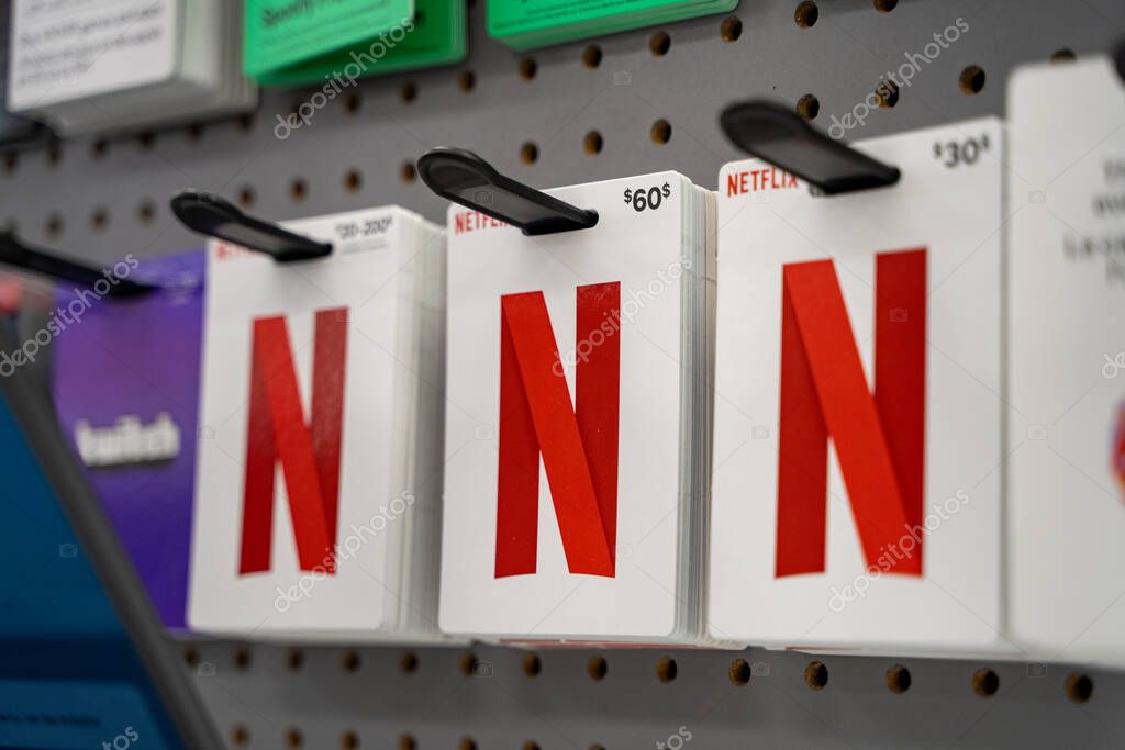 Netflix gift cards displayed on store rack. Toronto, Canada - October 3, 2025.