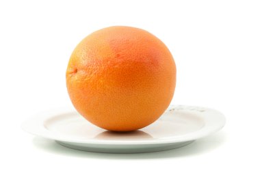 grapefruit on a plate white background