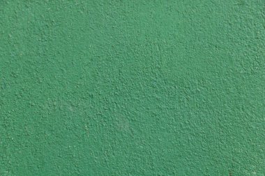 Düz, yeşil bir duvar dokusu ince detaylar ve küçük soyulmuş boya lekeleri. Arkaplan parlak yeşil parlak bir renktir...