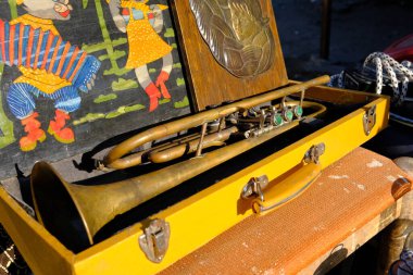 October 30, 2021. Ukraine, Dnipro, Flea market. Musical trumpet. Brass musical instrument of the alto-soprano register. Tool in a wooden case