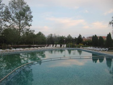 Pool fence. Outside swimming pool not working. Prohibition tape. Restriction on visiting the recreation area