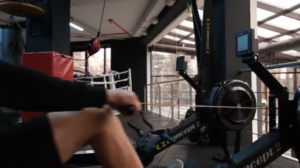 February 2023 Ukraine Dnipro Rowing Machine Firm Concept Man Workout — Stock Video