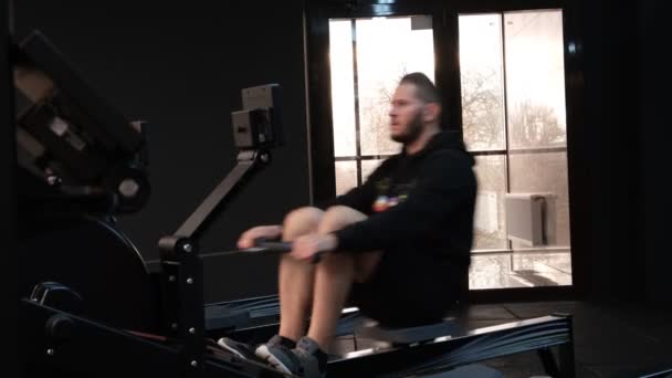 February 2023 Ukraine Dnipro Rowing Machine Firm Concept Man Workout — Vídeo de Stock