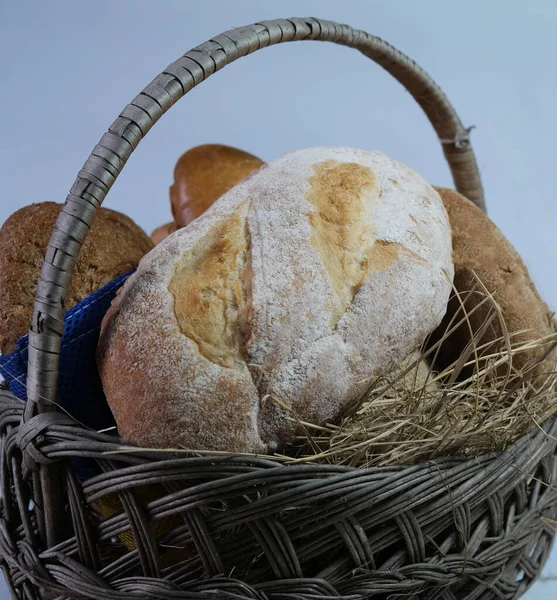 loaves of bread from the bakery in the store. Basket wicker with pastries. Various loaves, baguettes. Rye, buckwheat, bran, gluten-free, wheat in a confectionery. private bakery.