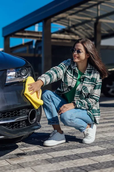 stock image Washing and cleanig car in a self-service car wash station.