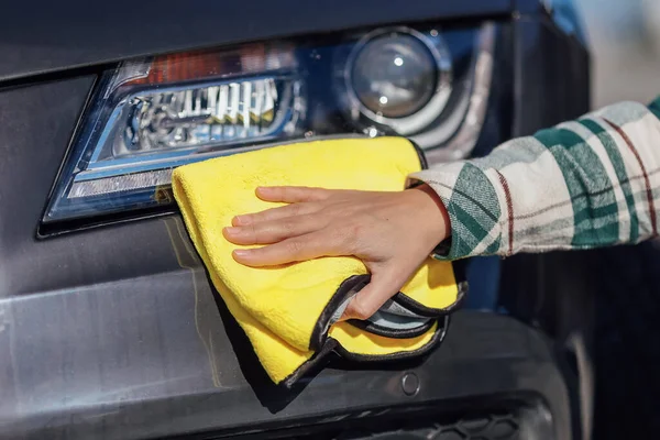 stock image Washing and cleanig car in a self-service car wash station.