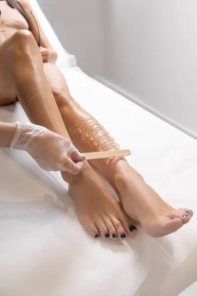 Hair removal procedure in beauty clinic