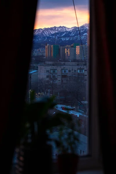 view from the window of the mountains at dawn.