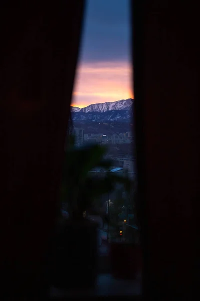 dawn on the background of mountains. view from the window.
