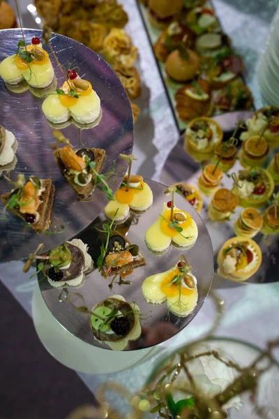 various canapes on the buffet table at the hotel.