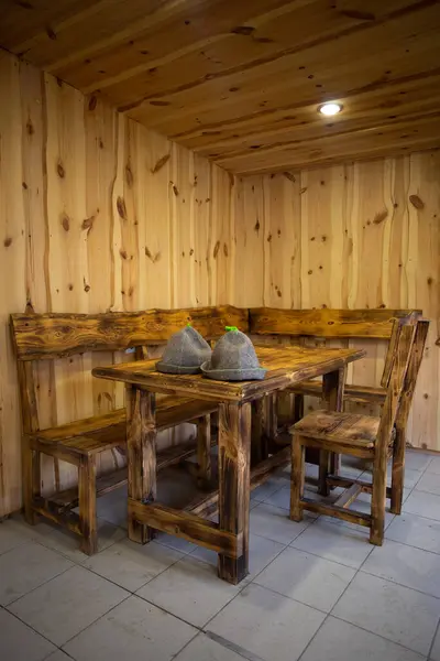 Warm and inviting cabin furniture with natural wood grain. Perfect for gathering around for meals or games with friends and family.