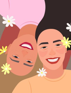 Kız arkadaşlar gülümsüyor, papatyalarla süslenmiş. Dostluk Günü 'nüz kutlu olsun..