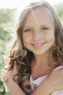 portrait of a young woman with long blond hair, girl with a beautiful smile