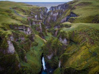 beautiful landscape with Fjarrgljfur canyon in Iceland clipart