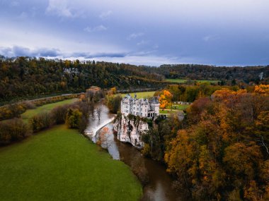 beautiful autumn view of the castle in the forest clipart