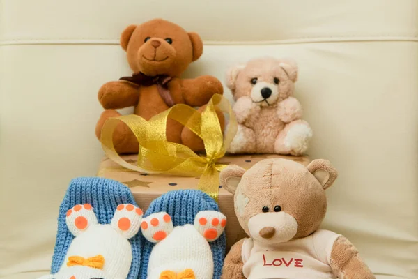 Teddy bears with a gift. Birthday and Christmas. Holidays and toys.