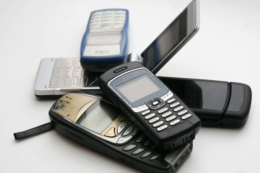 Vintage mobile phones on a light background.