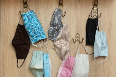 Protective face masks hanging in the hallway.