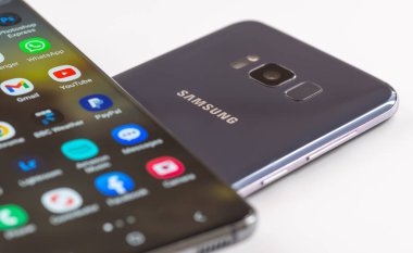 London. UK- 01.29.2023. The front and back of two Samsung smartphone showing the company name and trademark.