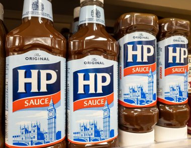 London. UK- 01.27.2023. Bottles of HP Sauce on display on the shelf of a grocery store.