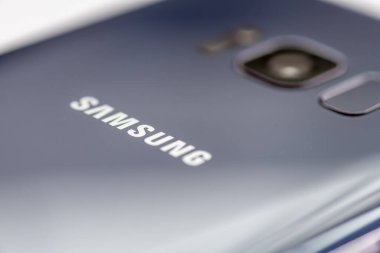 London. UK- 01.29.2023. The Samsung company name and trademark on the back of one of its smartphone.