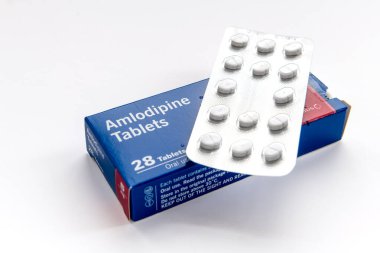 London. UK- 01.29.2023. A packet of Amlodipine tablets isolated in white. Medicine for the control of hypertension, high blood pressure.