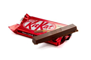 London. UK-02.12.2023. A packet of KitKat with a broken off chocolate bar on top. Isolated in a white background.