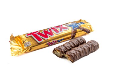 London. UK-02.12.2023. A packet of Twix chocolate bar with the chocolate in halves outside the packet isolated in white.