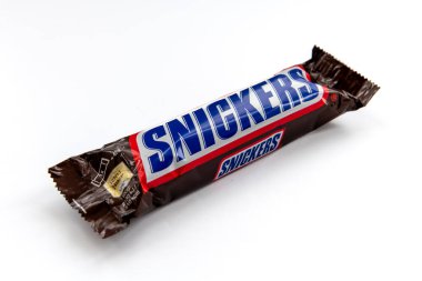 London. UK-02.12.2023. A packet of Snickers chocolate bar isolated in white.