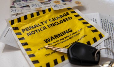 Close up of a penalty charge notice for parking offences. clipart