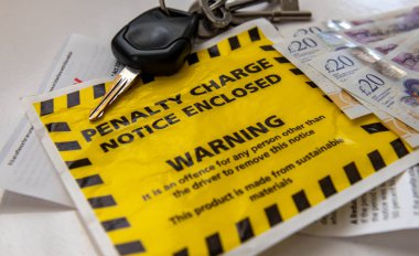 Close up of a penalty charge notice for parking offences. clipart