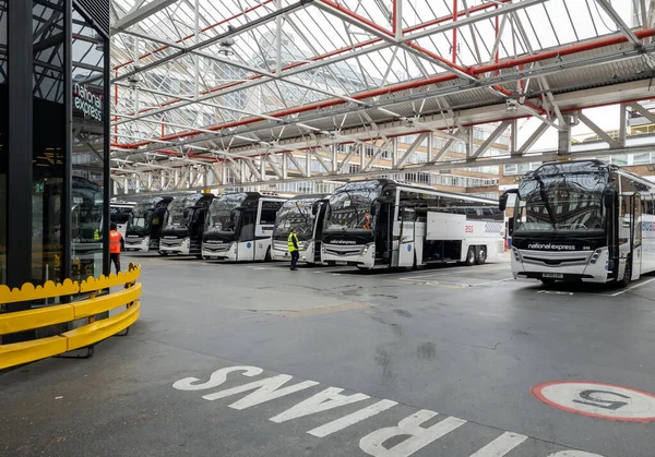 stock image London Victoria.UK-05.13.2023. Interior of the garages of London Victoria Coach Station with National Express coaches ready to take on passengers.