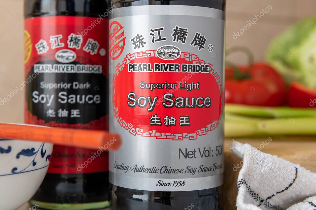 London. UK- 05.14.2023. Close up of a bottle of light and dark Pearl River Bridge soy sauce.