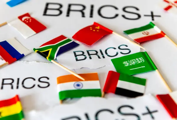 stock image A BRICS and BRICS+ concept with the words and country flags of the block of countries and new members.