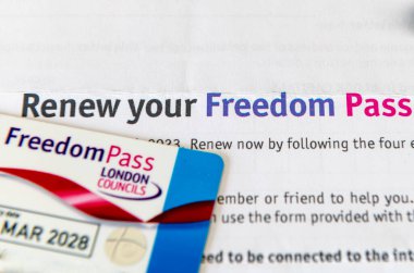 A retired person's Freedom Pass allowing free use of public transport and a letter for renewal of the pass. clipart