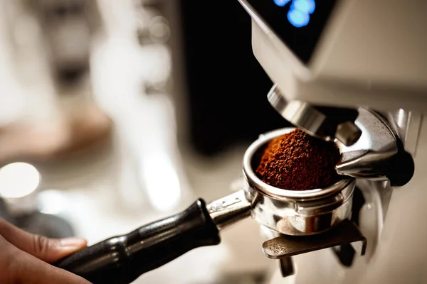 stock image Preparing fresh coffee. Closeup of tamping Fresh Ground Coffee.