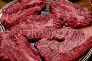 Korean Style Barbecue Grill BBQ rare meat on plate